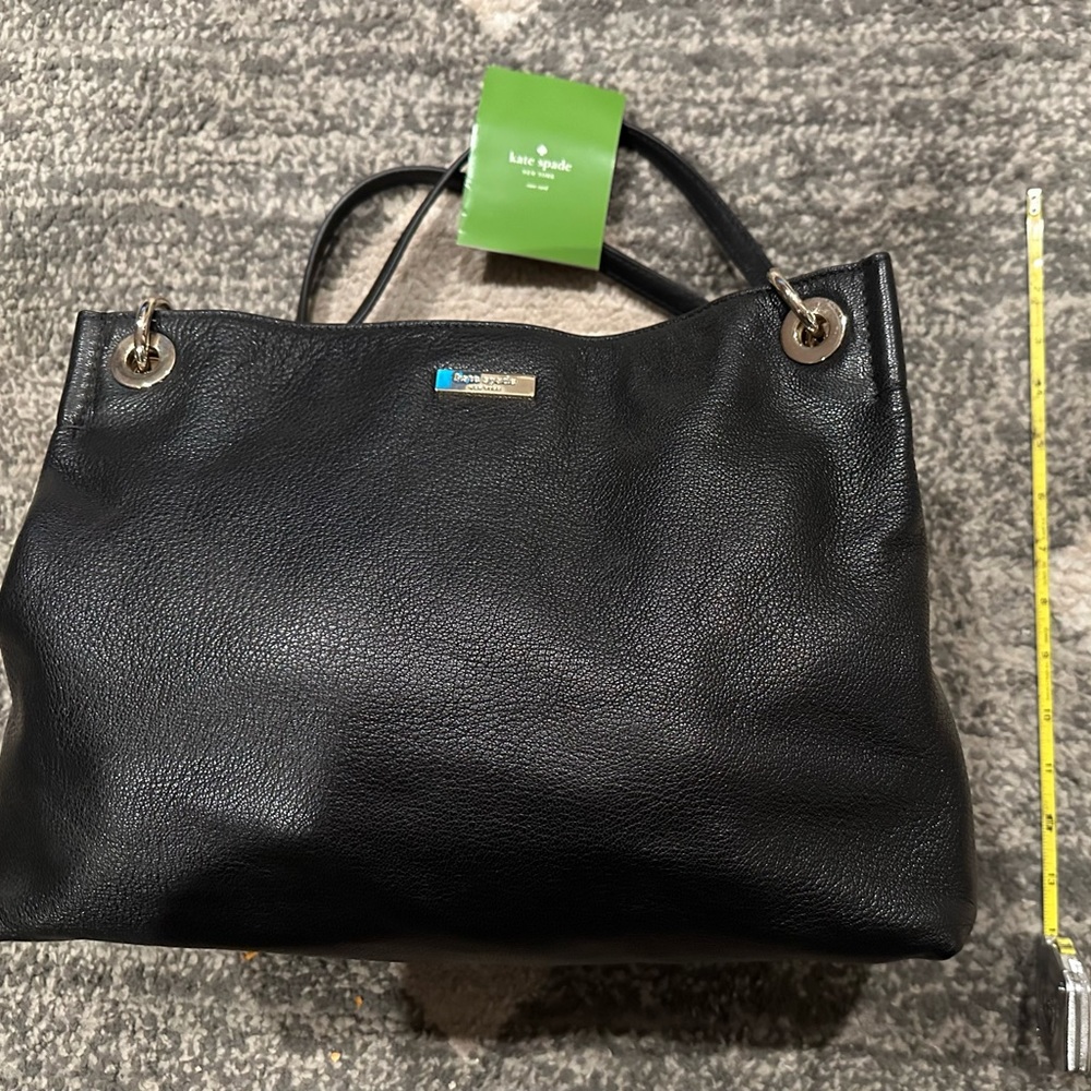 Authentic Kate Spade black shoulder bag with gold chain details.